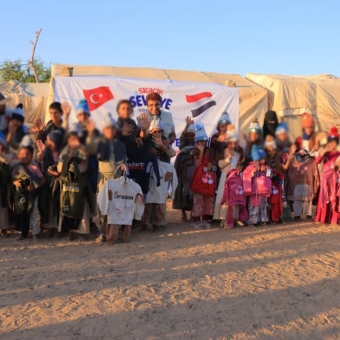 Winter clothing brings warmth to 500 orphans in camps